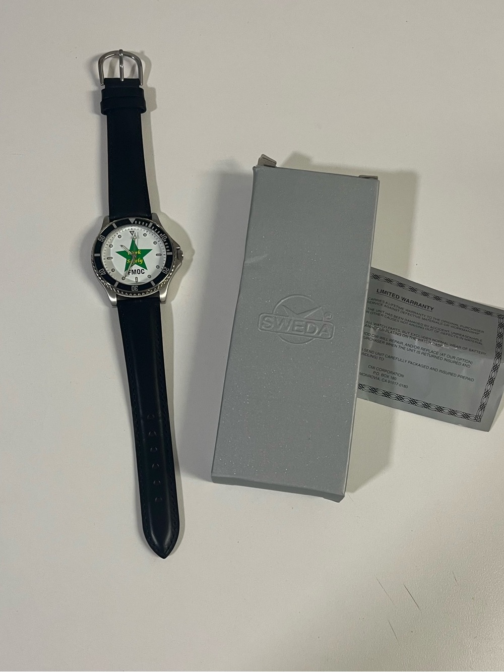 SWEDA watch with black leather strap